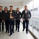 Shane Lowry, Bernd Wiesberger, Tommy Fleetwood, captain Padraig Harrington, Tyrrell Hatton and Lee Westwood of Team Europe walk to the gate with the Ryder Cup trophy before departing Heathrow Airport ahead of the 43rd Ryder Cup. Picture: Andrew Redington/Getty Images.