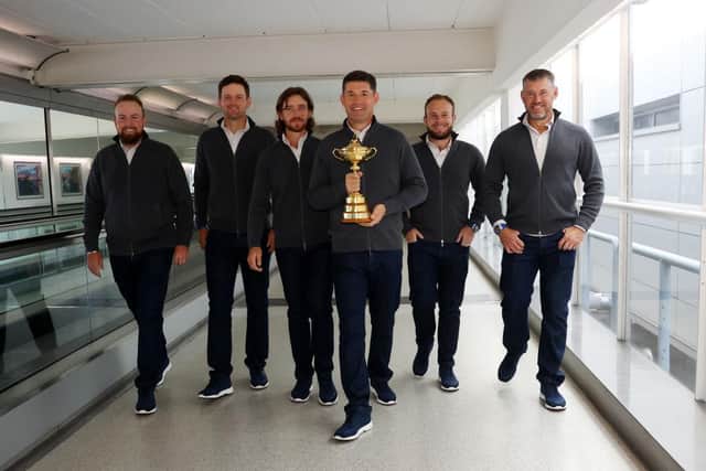 Shane Lowry, Bernd Wiesberger, Tommy Fleetwood, captain Padraig Harrington, Tyrrell Hatton and Lee Westwood of Team Europe walk to the gate with the Ryder Cup trophy before departing Heathrow Airport ahead of the 43rd Ryder Cup. Picture: Andrew Redington/Getty Images.