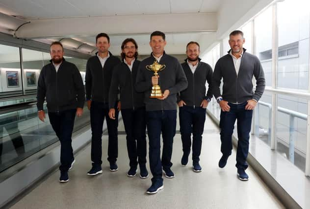 Shane Lowry, Bernd Wiesberger, Tommy Fleetwood, captain Padraig Harrington, Tyrrell Hatton and Lee Westwood of Team Europe walk to the gate with the Ryder Cup trophy before departing Heathrow Airport ahead of the 43rd Ryder Cup. Picture: Andrew Redington/Getty Images.