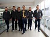 Shane Lowry, Bernd Wiesberger, Tommy Fleetwood, captain Padraig Harrington, Tyrrell Hatton and Lee Westwood of Team Europe walk to the gate with the Ryder Cup trophy before departing Heathrow Airport ahead of the 43rd Ryder Cup. Picture: Andrew Redington/Getty Images.