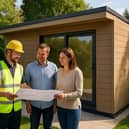 A My Outhouse Garden Rooms installer discusses plans with homeowners beside a freshly completed, composite-clad garden room—reflecting the firm’s new Which? Trusted Trader accreditation and focus on quality craftsmanship.