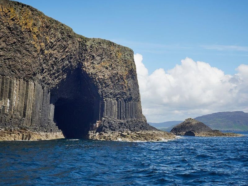 The beautiful Fingal's Cave is located on Isle of Staffa in the Inner Hebrides of Scotland. While it is stunning to look at, it is also well known for its natural acoustics. Comprised entirely of spectacular hexagonal basalt columns, it is similar to the popular Giant's Causeway in Northern Ireland.