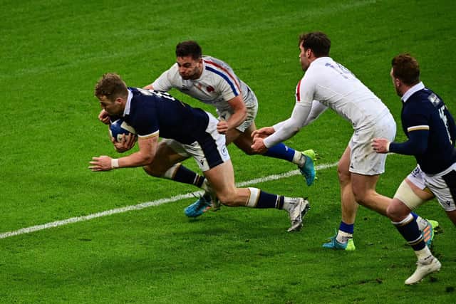 Duhan van der Merwe scores the winning try in injury time in Scotland's win over France last year. (Photo by MARTIN BUREAU/AFP via Getty Images)