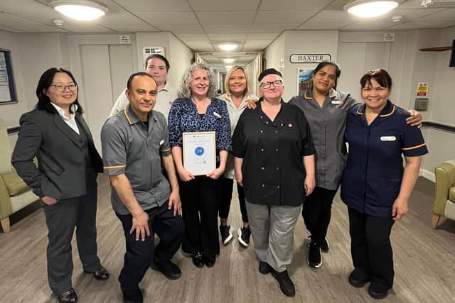 The team at HC-One Scotland’s Ballumbie Court Care Home celebrating their perfect 10/10 carehome.co.uk review rating