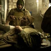 Medics tend to a casualty in a frontline Ukrainian field hospital outside Bakhmut. The Russian invasion saw Stewart McDonald MP work constructively with the UK Government on defence matters (Picture: Chris McGrath/Getty Images)