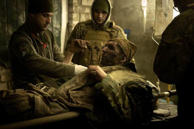 Medics tend to a casualty in a frontline Ukrainian field hospital outside Bakhmut. The Russian invasion saw Stewart McDonald MP work constructively with the UK Government on defence matters (Picture: Chris McGrath/Getty Images)