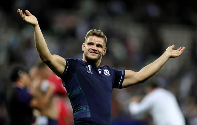 George Turner celebrates Scotland's victory over Tonga at full-time. (Photo by David Rogers/Getty Images)