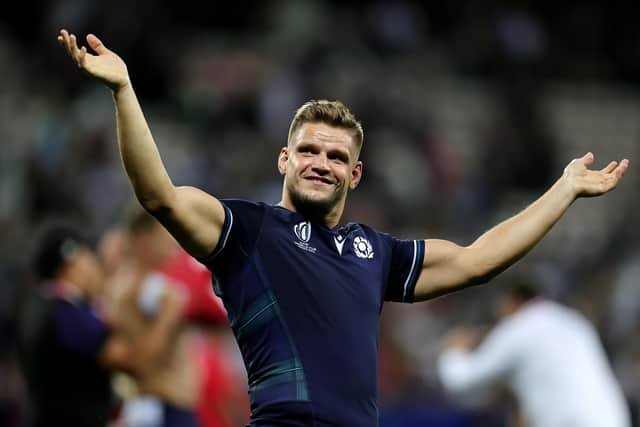 George Turner celebrates Scotland's victory over Tonga at full-time. (Photo by David Rogers/Getty Images)