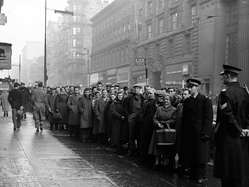 Football fans queue in Glasgow for Tickets to Celtic v Rangers - New Years Day Match