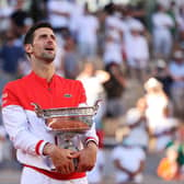 Novak Djokovic celebrates as he holds the trophy after winning the French Open final against Stefanos Tsitsipas at Roland Garros. (Photo by Clive Brunskill/Getty Images)