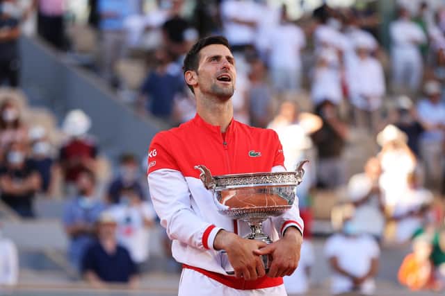 Novak Djokovic celebrates as he holds the trophy after winning the French Open final against Stefanos Tsitsipas at Roland Garros. (Photo by Clive Brunskill/Getty Images)