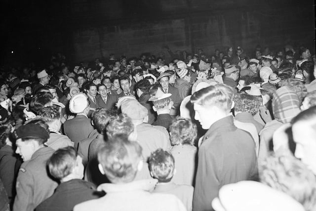 A crowd of revellers at the Tron on Hogmanay in 1959.