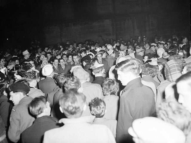 A crowd of revellers at the Tron on Hogmanay in 1959.