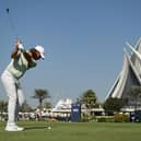 Tommy Fleetwood plays his second shot on the 18th hole during the third round of the Dubai Invitational at Dubai Creek Golf and Yacht Club. Picture: Alex Burstow/Getty Images.
