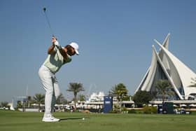 Tommy Fleetwood plays his second shot on the 18th hole during the third round of the Dubai Invitational at Dubai Creek Golf and Yacht Club. Picture: Alex Burstow/Getty Images.