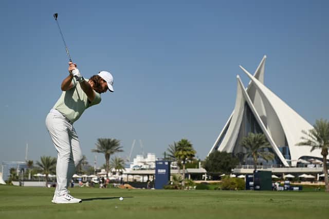 Tommy Fleetwood plays his second shot on the 18th hole during the third round of the Dubai Invitational at Dubai Creek Golf and Yacht Club. Picture: Alex Burstow/Getty Images.