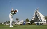 Tommy Fleetwood plays his second shot on the 18th hole during the third round of the Dubai Invitational at Dubai Creek Golf and Yacht Club. Picture: Alex Burstow/Getty Images.