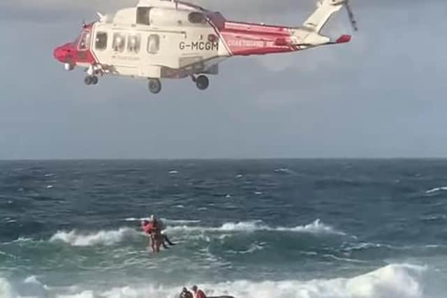 The casualty was winched to safety by a rescue helicopter.
