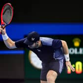 Andy Murray throws his racket in frustration during the defeat by Alex de Minaur.