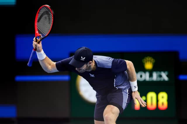 Andy Murray throws his racket in frustration during the defeat by Alex de Minaur.