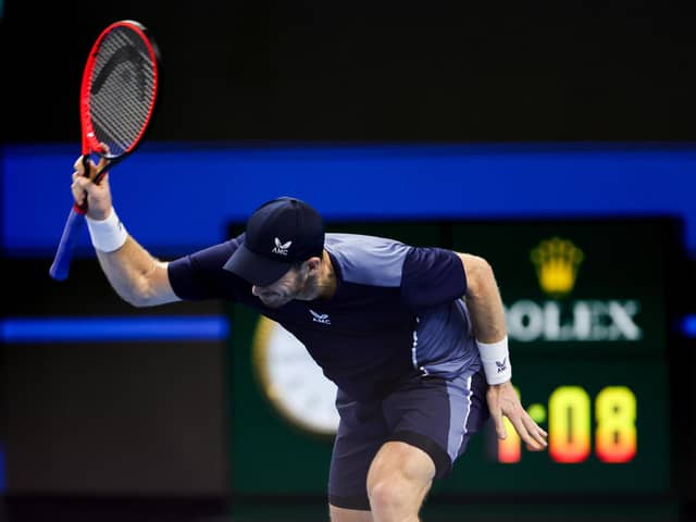Andy Murray throws his racket in frustration during the defeat by Alex de Minaur.