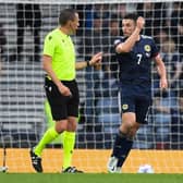 Scotland's John McGinn (R) complains to referee Sebastian Gishamer after an Armenian player throws a water bottle during a UEFA Nations League match between Scotland and Armenia at Hampden Park, on June  08, 2022, in Glasgow, Scotland. (Photo by Ross MacDonald / SNS Group)