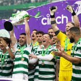 Celtic's Greg Taylor lifts the Premiership trophy after the 5-0 win over Aberdeen. (Photo by Craig Williamson / SNS Group)