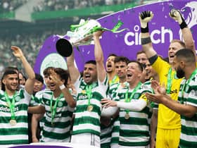 Celtic's Greg Taylor lifts the Premiership trophy after the 5-0 win over Aberdeen. (Photo by Craig Williamson / SNS Group)