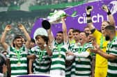 Celtic's Greg Taylor lifts the Premiership trophy after the 5-0 win over Aberdeen. (Photo by Craig Williamson / SNS Group)