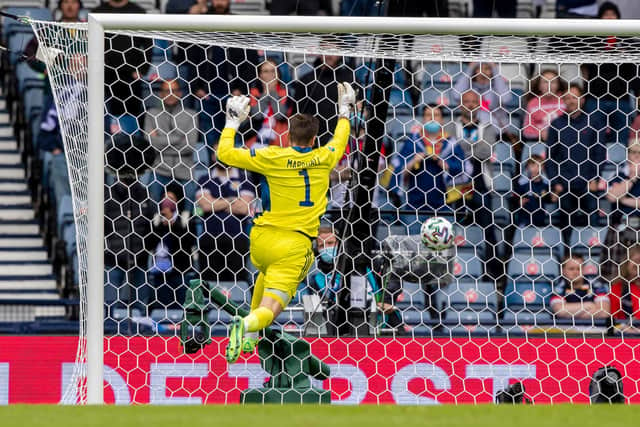 David Marshall falls into the net after Schick's strike.