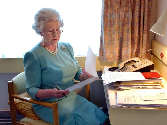 The Queen at work on the Royal Train. Picture: Fiona Hanson/Press Association
