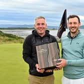 Tomatin managing director Stephen Bremner, left, presented a very special and rare 50-year-old Tomatin single malt to winner Matthew Nixon. Picture: Highland Golf Links Pro-Am