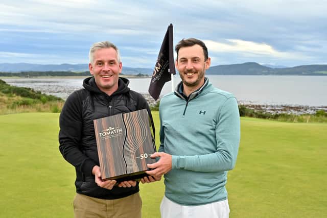 Tomatin managing director Stephen Bremner, left, presented a very special and rare 50-year-old Tomatin single malt to winner Matthew Nixon. Picture: Highland Golf Links Pro-Am