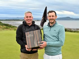 Tomatin managing director Stephen Bremner, left, presented a very special and rare 50-year-old Tomatin single malt to winner Matthew Nixon. Picture: Highland Golf Links Pro-Am