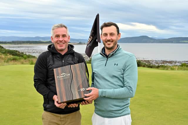 Tomatin managing director Stephen Bremner, left, presented a very special and rare 50-year-old Tomatin single malt to winner Matthew Nixon. Picture: Highland Golf Links Pro-Am