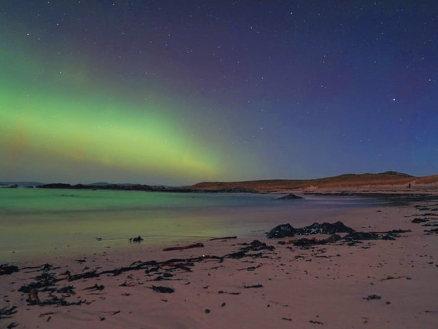 Handout photo taken with permission from the twitter account of @itshannahlclose of the northern lights over the Hebrides in Scotland. Picture date: Monday February 27, 2023.