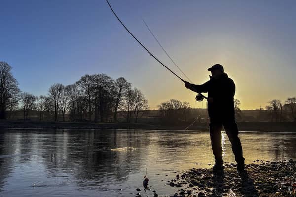 A fisherman casts a line on the River Tay. Scottish Water has been accused of covering up the release of wet wipes, sanitary pads and other sewage litter into the river in Perthshire. Picture: Lisa Ferguson