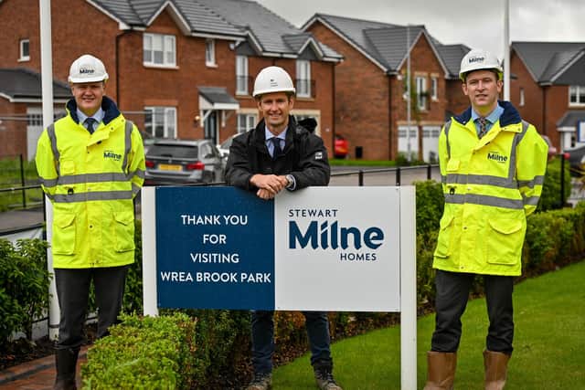 Paul Challinor MD Stewart Milne Homes North West, Terry Errington head of structured real estate finance, Homes England and Neil Washington, finance director Stewart Milne Homes North West at Wrea Brook Park.