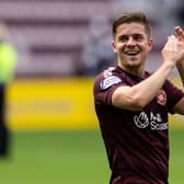 Hearts' Cammy Devlin has extended his contract at the club.