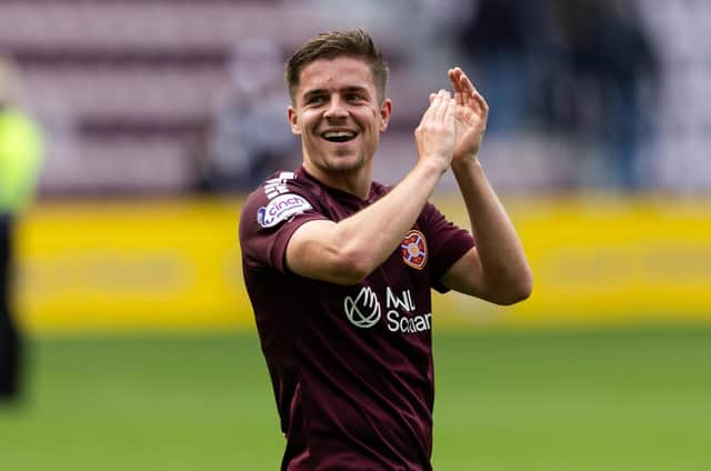 Hearts' Cammy Devlin has extended his contract at the club.