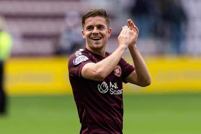 Hearts' Cammy Devlin has extended his contract at the club.