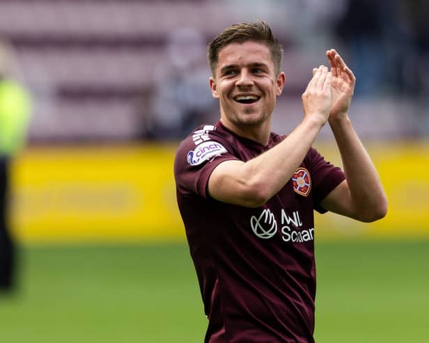 Hearts' Cammy Devlin has extended his contract at the club.