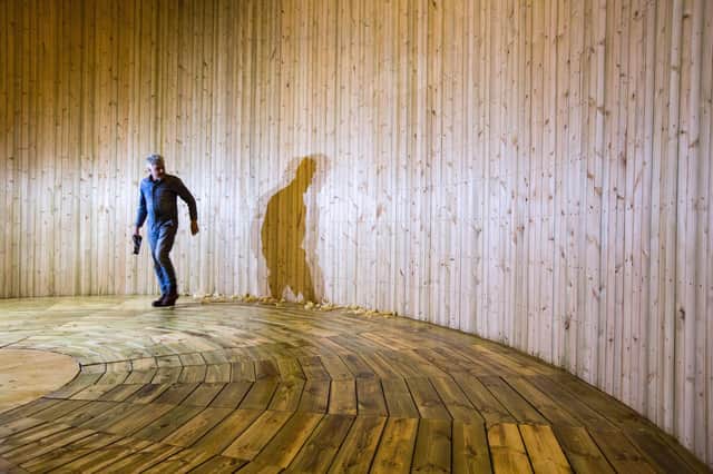 Artist Stephen Skrynka planing the inside the structure. PIC: Robert Perry.