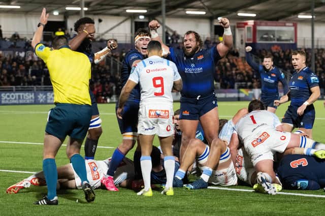 Edinburgh's Pierre Schoeman (centre) celebrates as Ewan Ashman touches down for a try during the win over Vodacom Bulls. (Photo by Paul Devlin / SNS Group)