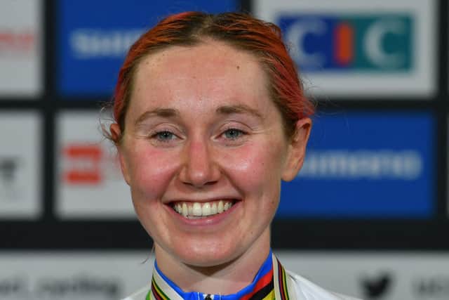 Gold medallist Britain's Katie Archibald poses with her rainbow world champion jersey as she celebrates on the podium after victory in the women's Omnium Points Race 4/4 during the UCI Track Cycling World Championships.