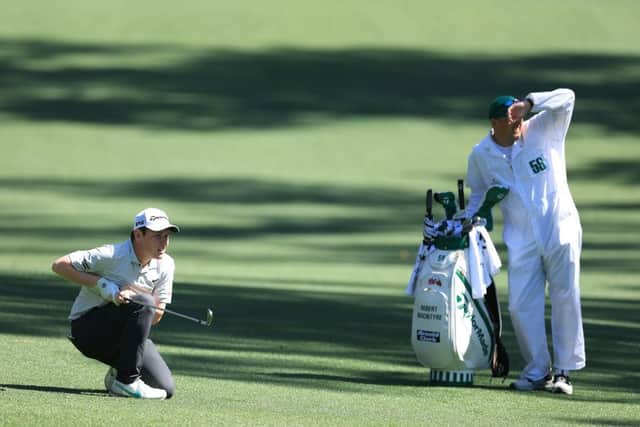 Bob MacIntyre and caddie Mikey Thomson follow his second shot on the 13th hole during the first round of The Masters at Augusta National Golf Club. Picture: David Cannon/Getty Images.