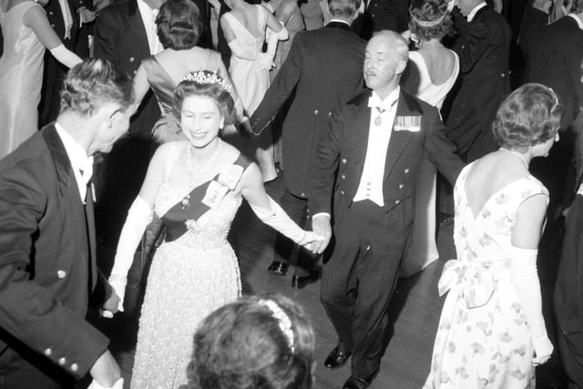 Queen Elizabeth II dances an eightsome reel at the Royal Company of Archers' Ball in the Assembly Rooms, Edinburgh, in June 1966.