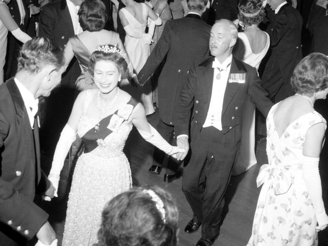 Queen Elizabeth II dances an eightsome reel at the Royal Company of Archers' Ball in the Assembly Rooms, Edinburgh, in June 1966.