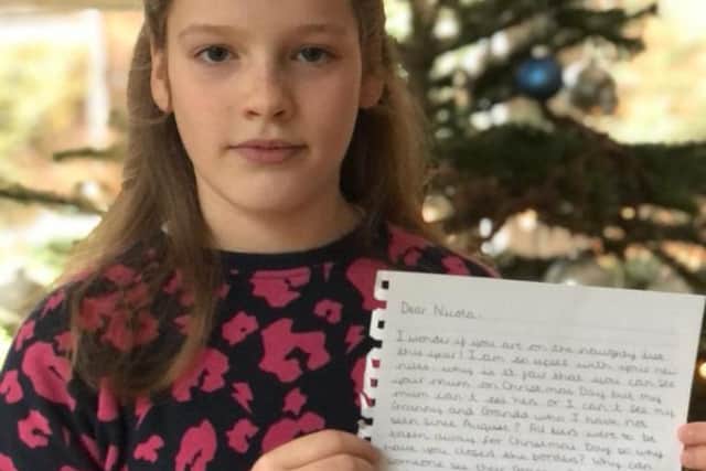 Molly, 10, with her letter addressed to Nicola Sturgeon where she asks the First Minister to relax cross border rules on Christmas day so that she can see her grandparents picture: supplied