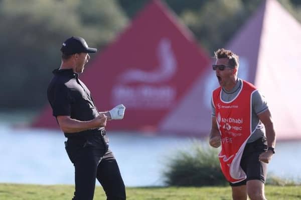 Victor Perez and his caddie James Erkenbeck celebrate the Frenchman holing out of a greenside bunker in the final round.Picture: Oisin Keniry/Getty Images.